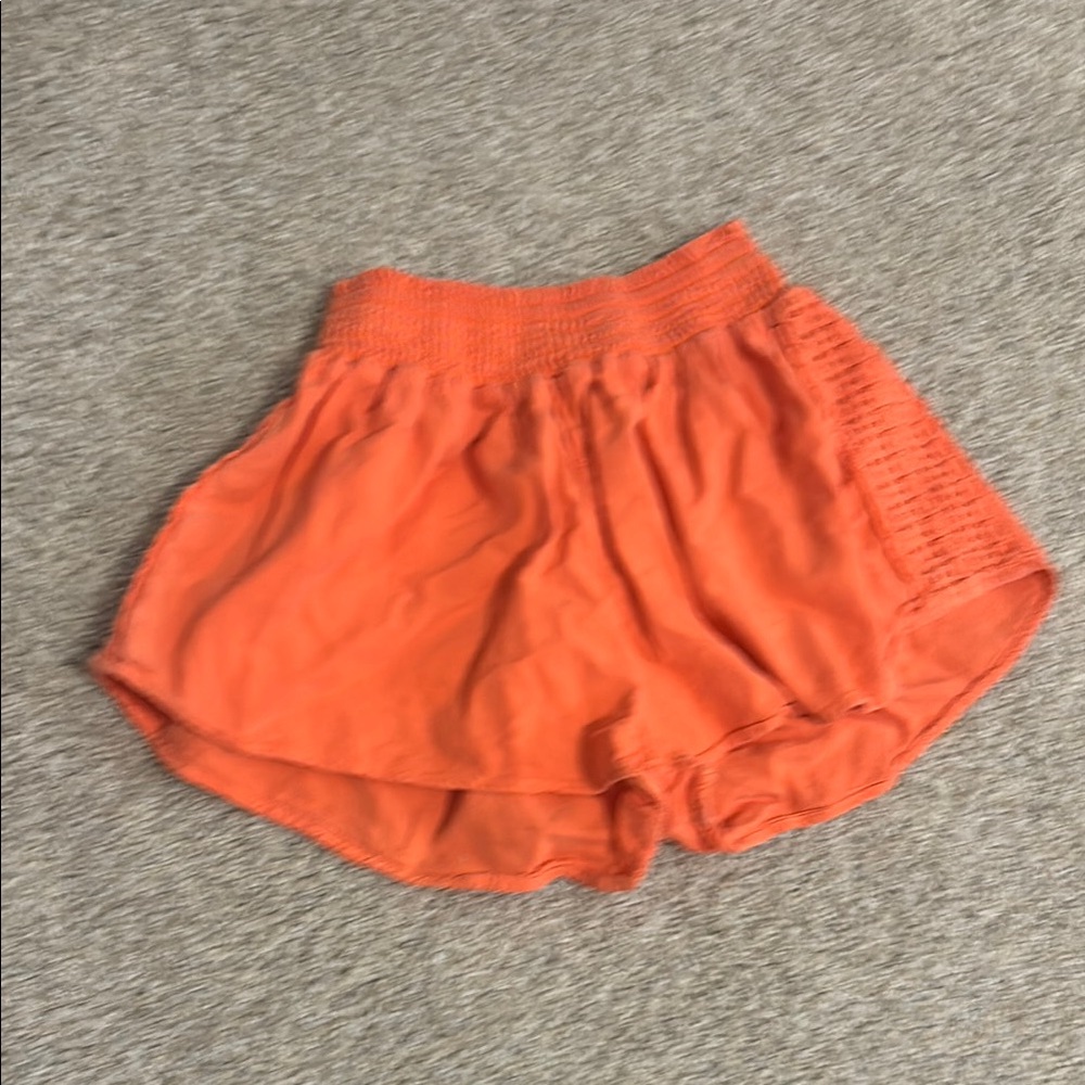 Orange Athletic Shorts with Elastic Waistband and Layered Design